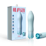 Retail display of Singapore Blush Oh My Gem blue vibrator alongside its branded box, featuring callouts for RumbleTech™, Magna Charge™, and UltraSilk®—a sleek, giftable vibe designed for LGBTQIA+ intimacy.