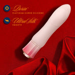 Singapore Blush Oh My Gem vibrator resting on rich red silk, spotlighting its platinum-cured silicone body and sensual contours—perfect for trans femme, androgynous, or lesbian pleasure-seekers wanting luxe stimulation.