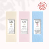 Line-up of HARU lubricants—Dewy, Feminine Care, and Nude—each in pastel-hued boxes, representing inclusive self-care and sensory pleasure for LGBTQIA+ bodies and needs.