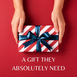 Hands holding a red and white striped gift box tied with a navy blue ribbon against a bold red background, with the text “A Gift They Absolutely Need”—perfect visual for TOMSCOUT’s digital gift card, ideal for birthdays, holidays, or gender-affirming milestones.