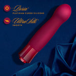 Singapore Blush Oh My Gem “Classy” vibe resting on rich blue satin fabric, emphasizing its smooth UltraSilk® silicone and elegant aesthetic—blending gender expression with luxe erotic empowerment.