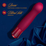 Singapore Blush Oh My Gem “Classy” vibe resting on rich blue satin fabric, emphasizing its smooth UltraSilk® silicone and elegant aesthetic—blending gender expression with luxe erotic empowerment.