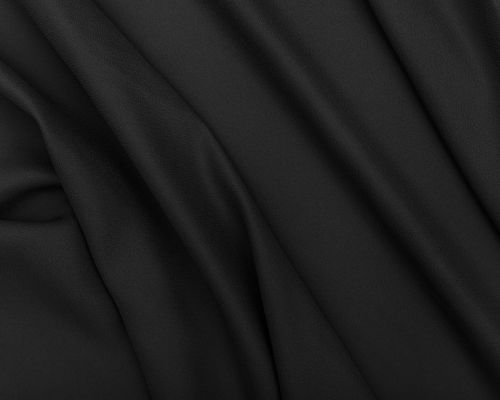 Matte black performance knit fabric used in TOMSCOUT chest binders, offering high-compression support with a soft-touch finish. Designed for non-binary and FTM wearers seeking secure flattening without skin irritation—durable, breathable, and tailored for daily movement. TOMSCOUT STRENGTH Chest Binder