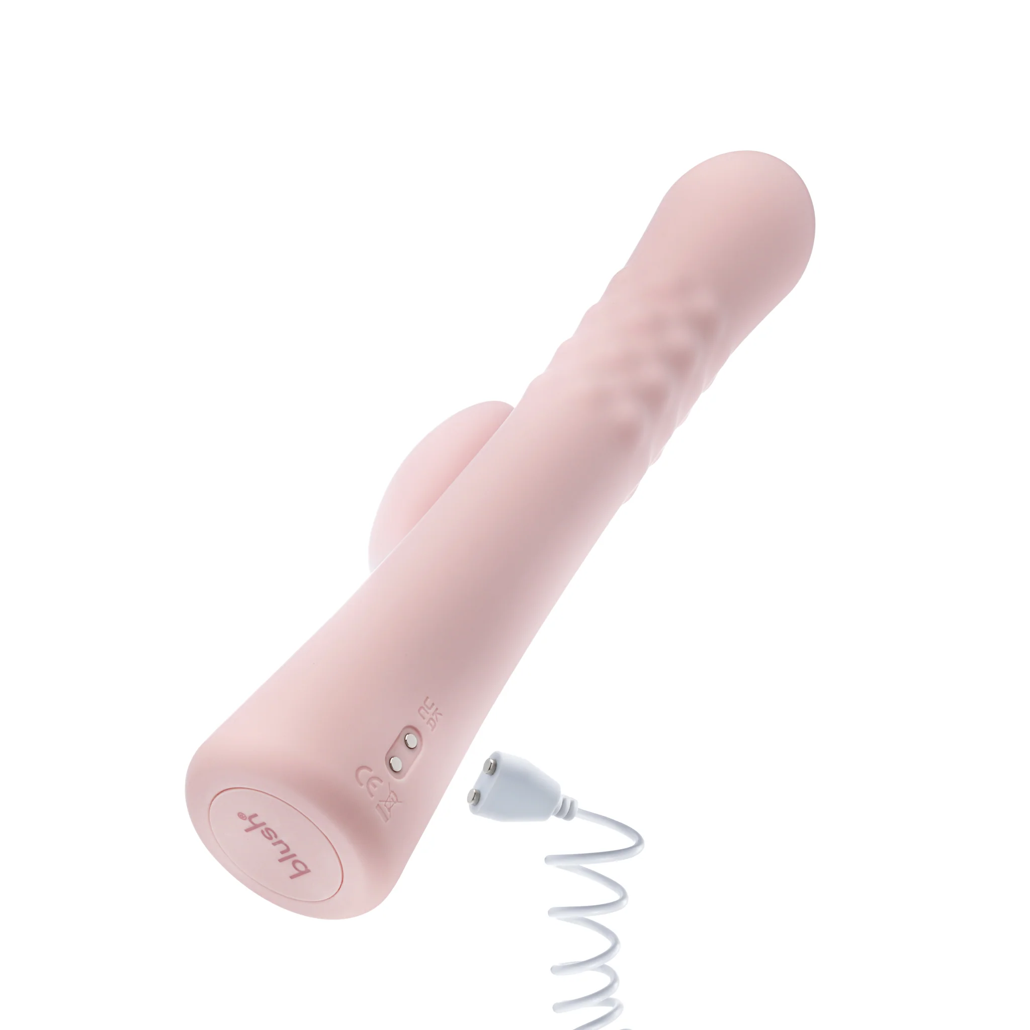 Close-up of the Singapore Blush Jaymie rabbit vibrator in soft matte pink, highlighting the magnetic USB charging cable—perfect for non-binary and FTM users seeking convenience and sleek design in their pleasure tools.