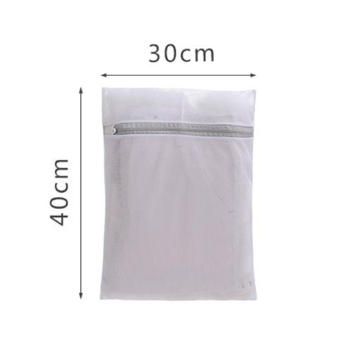 Mesh laundry bag measuring 30cm by 40cm—ideal for washing single TOMSCOUT binders or compression shorts while maintaining shape and stretch. Simple, effective care solution for gender-affirming garments.