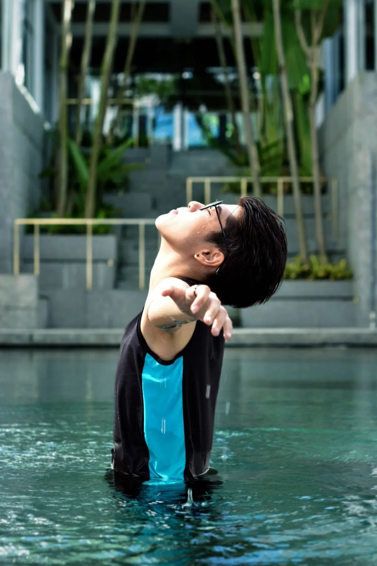 FTM transgender swimmer in a gender-affirming TOMSCOUT swimming chest binder, embracing freedom in the water — swimwear designed for tomboy, non-binary, and transmasc bodies.
