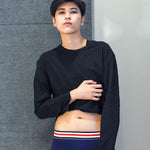 Androgynous model wearing navy boxer briefs with a red, white, and blue waistband, paired with a black crop top. The gender-neutral silhouette highlights TOMSCOUT’s inclusive underwear line—soft, stretchy, and built for comfort and dysphoria-safe style.