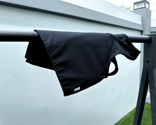 Air drying a TOMSCOUT chest binder on a flat surface—key step to maintain fabric structure and prolong binder lifespan.