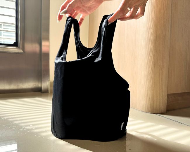 Freshly washed TOMSCOUT binder standing upright—ready for air drying after gentle cycle wash.