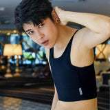 A non-binary androgynous tomboy, transgender man wearing a black color of a bandage TOMSCOUT 20cm bandage Chest Binder to fight body dysphoria and working out with the binder, TOMSCOUT STRENGTH bandage binder.