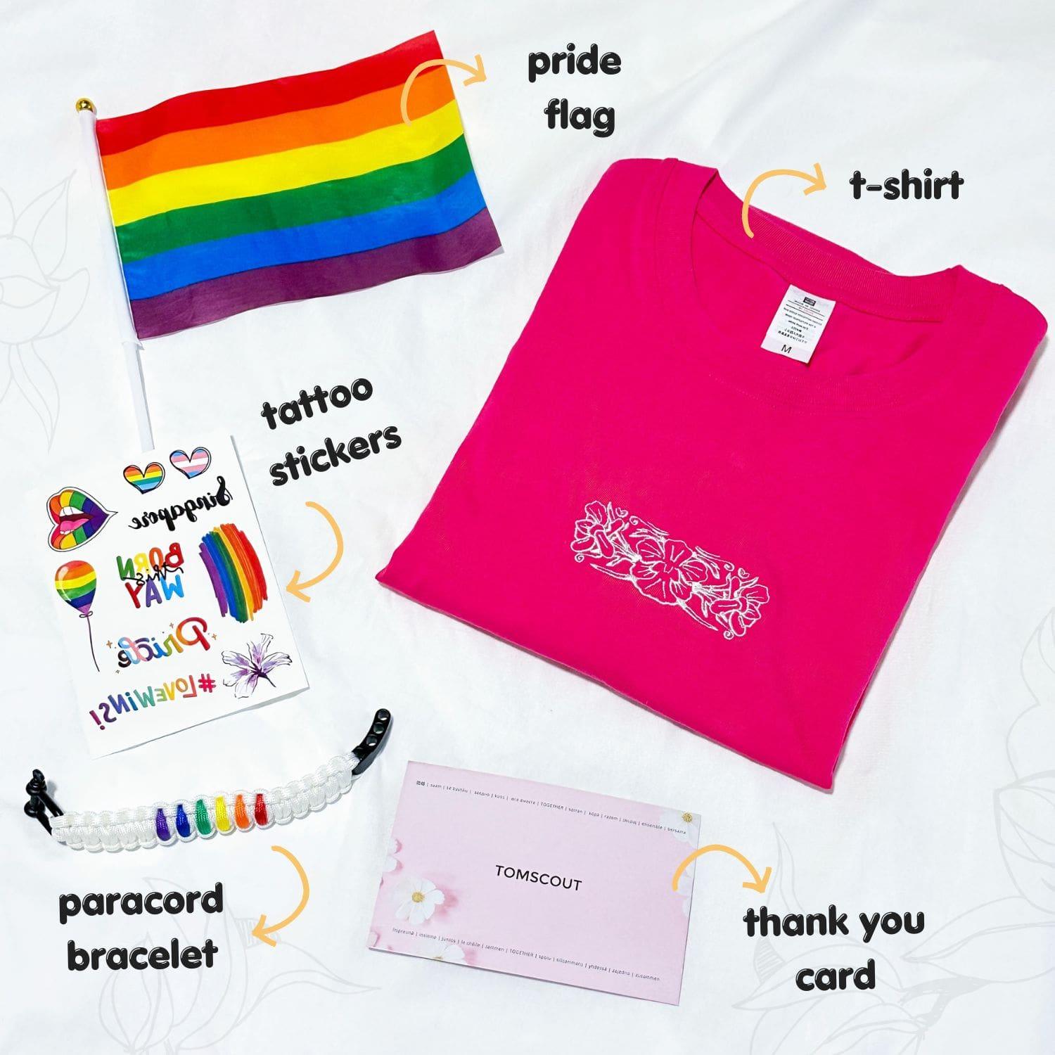 The product photo of a pride kit includes a hot pink t-shirt, a small pride flag, a paracord bracelet, a tattoo sticker, and a thank you card. TOMSCOUT Flourish - LGBT Pride Kits (Singapore)
