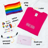 Product photo of the TOMSCOUT Flourish - LGBT Pride Kits from Singapore, showcasing an all-inclusive pride kit with a hot pink t-shirt, a vibrant small pride flag, a stylish paracord bracelet, a unique tattoo sticker, and a heartfelt thank you card, embodying diversity and LGBTQ+ community support.