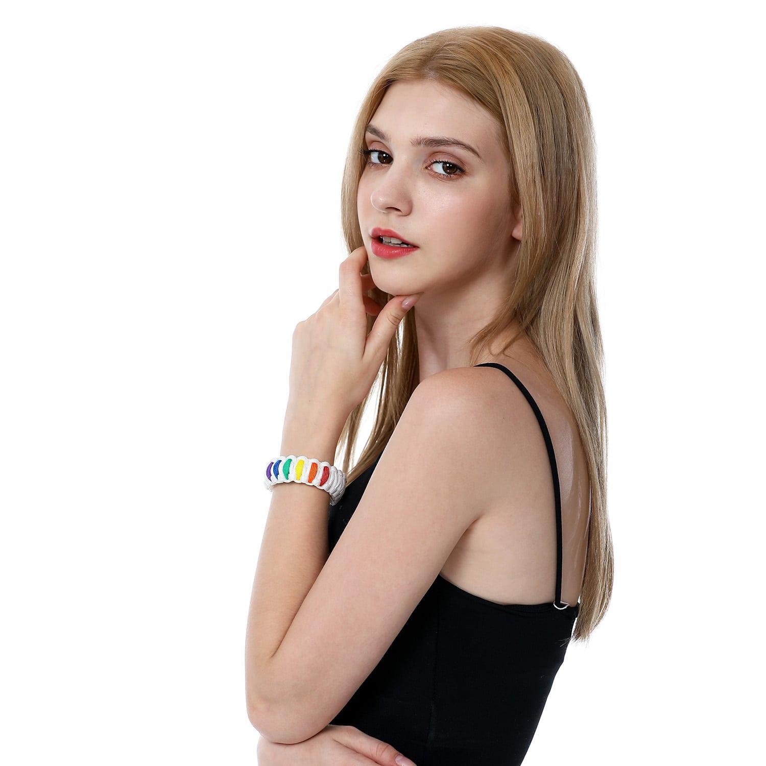 Stylish Model Wearing TOMSCOUT LGBTQ+ Pride Paracord Bracelet - Rainbow Design.