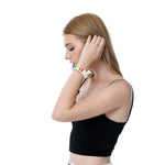 Stylish Model Wearing TOMSCOUT LGBTQ+ Pride Paracord Bracelet - Rainbow Design.