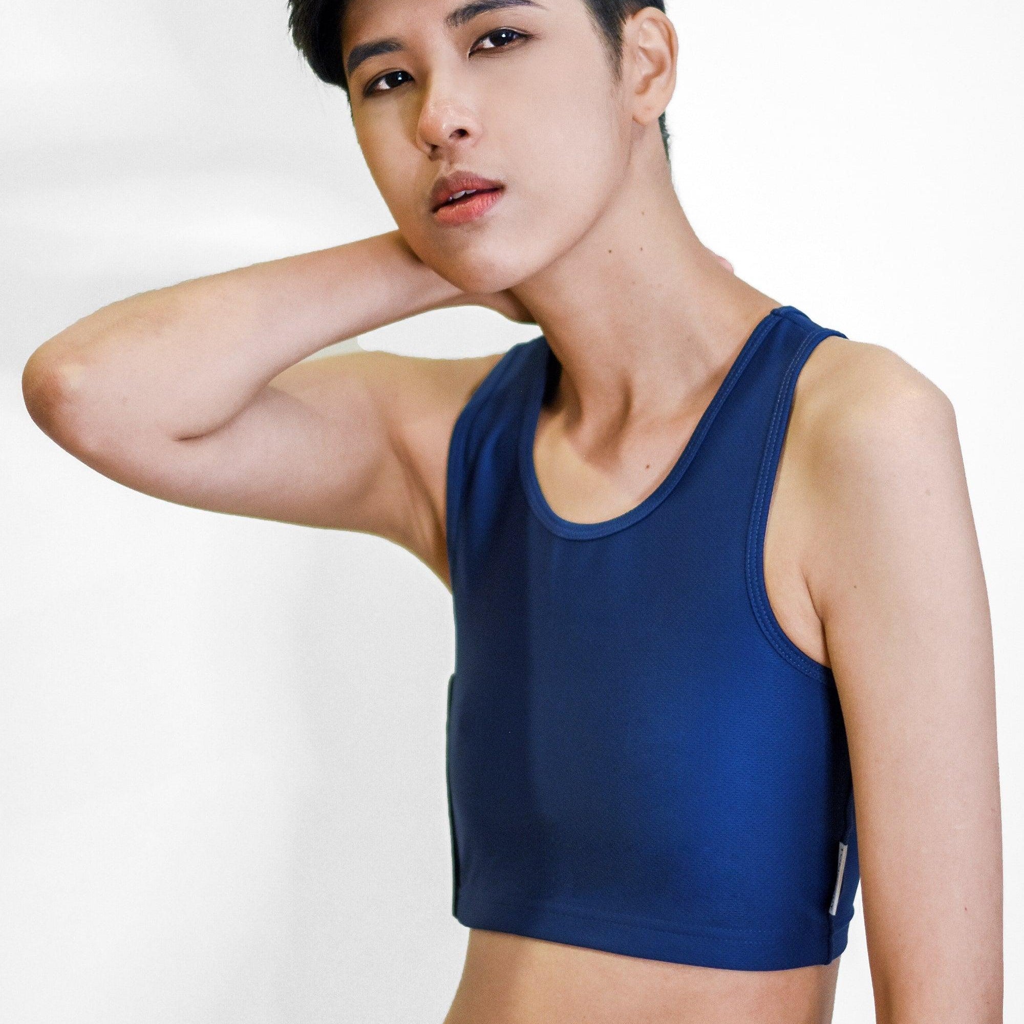 Non-binary Tomboy in a navy color non-bandage TOMSCOUT Chest Binder, part of the TOMSCOUT ACTIVE BINDER collection, showcasing a clearance binder that's affordable yet high quality.