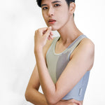 Non-binary Tomboy in a grey color non-bandage TOMSCOUT Chest Binder, part of the TOMSCOUT ACTIVE BINDER collection, showcasing a clearance binder that's affordable yet high quality.