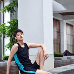 A non-binary androgynous tomboy, transgender man wearing a black color of a bandage TOMSCOUT Swimming Chest Binder to fight body dysphoria and swimming in the pool, TOMSCOUT SAPPHIRE SWIMMING BINDER.