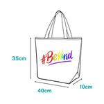 #BeKind - Showcase your support and pride with the TOMSCOUT pride tote bag, a product that combines sustainable fashion with a powerful message of kindness, inclusivity, and LGBTQ+ solidarity, captured in this striking product image.